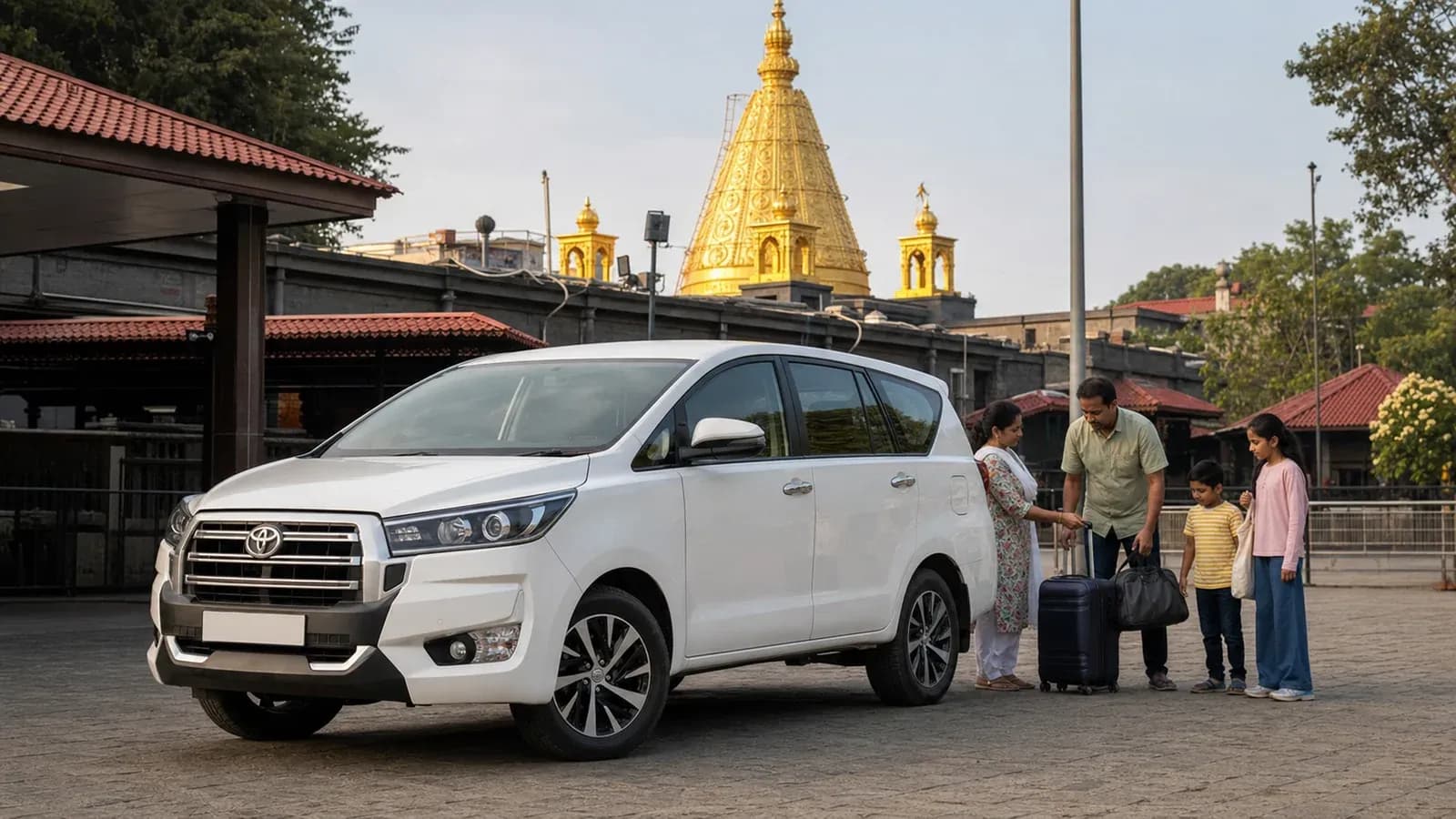 Family arriving in Shirdi beside a white Innova Crysta class vehicle