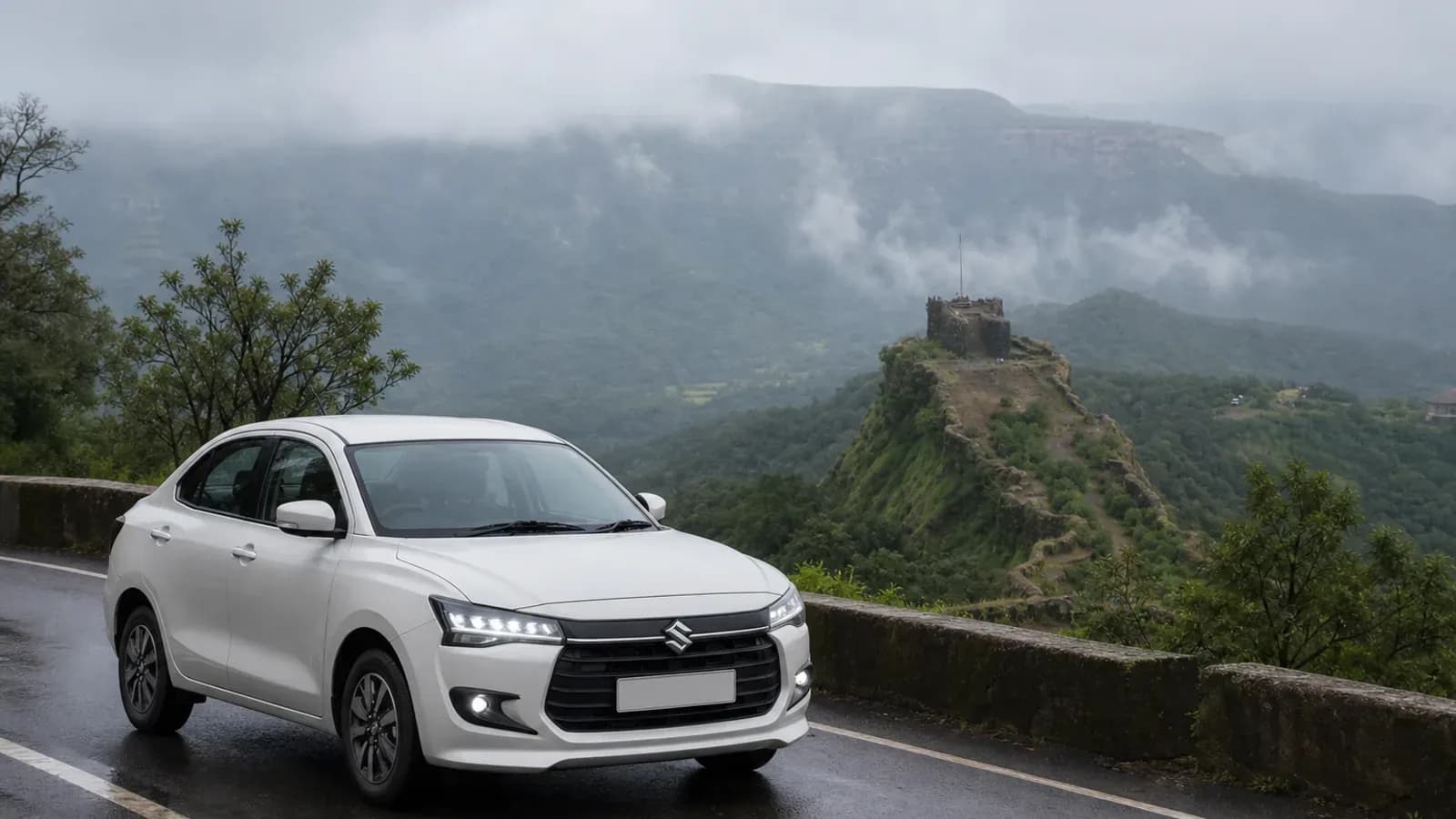 White Maruti Suzuki Dzire on a misty Western Ghats road near Pratapgad and Mahabaleshwar